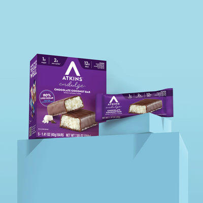 Atkins endulge chocolate coconut bar packaging on a light blue background