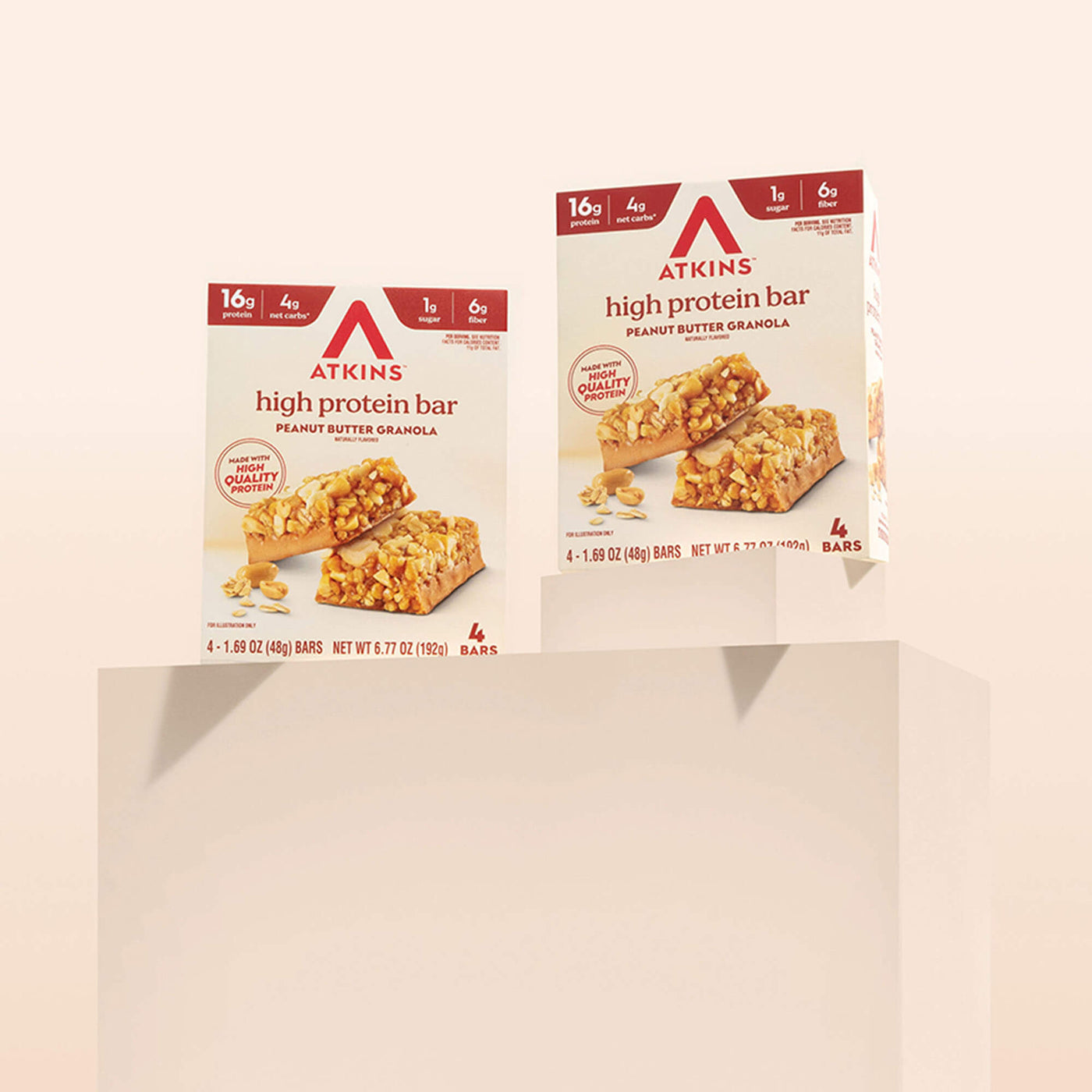 Two boxes of Atkins high protein bars on a beige background