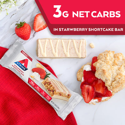 Strawberry Shortcake Bar with strawberries, shortcake and red cloth on marble table; 3G Net Carbs in Strawberry shortcake bar