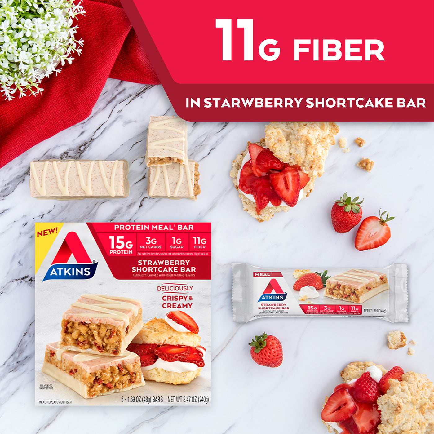 Strawberry Shortcake Bar with strawberries, shortcake and red cloth on marble table; 11G Fiber in Strawberry shortcake bar