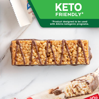 Chocolate Almond Caramel Bar with almond, caramel and blue cloth on marble table; Keto The Atkins Way* *Product designed to be used with Atkins ketogenic programs.