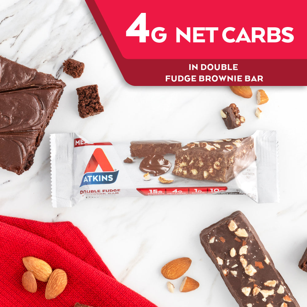 Double Fudge Brownie Bar with almond and chocolate next to it on a marble table; 4G Net Carbs in Double fudge brownie bar