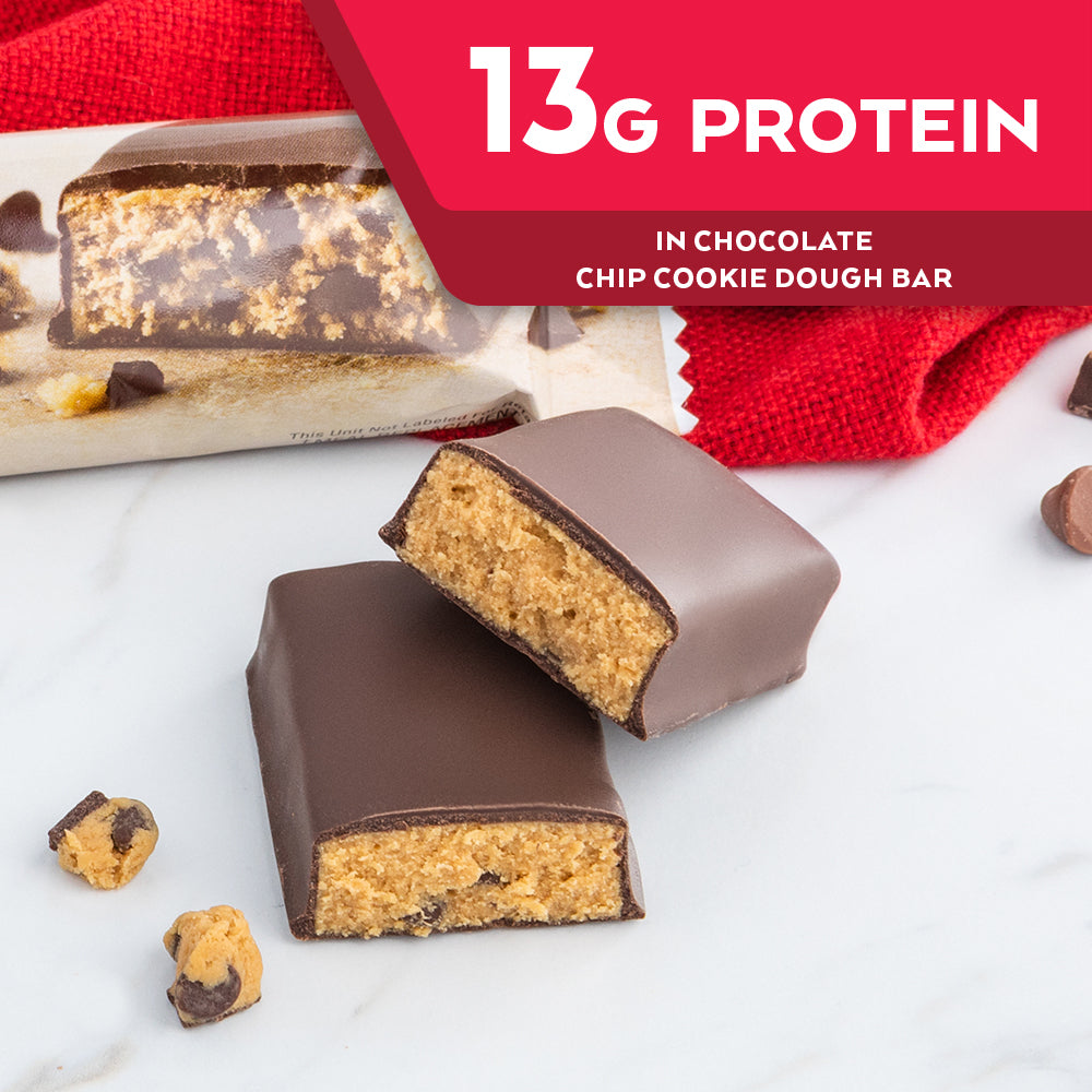 Chocolate Chip Cookie Dough Bar with red cloth on marble table; 13G Protein in Chocolate chip cookie dough bar 