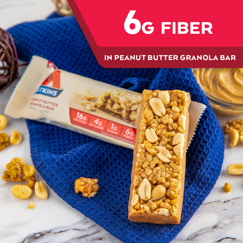 Peanut Butter Granola Bar with peanut butter and blue cloth on marble table; 6G Fiber in Peanut Butter Granola Bar