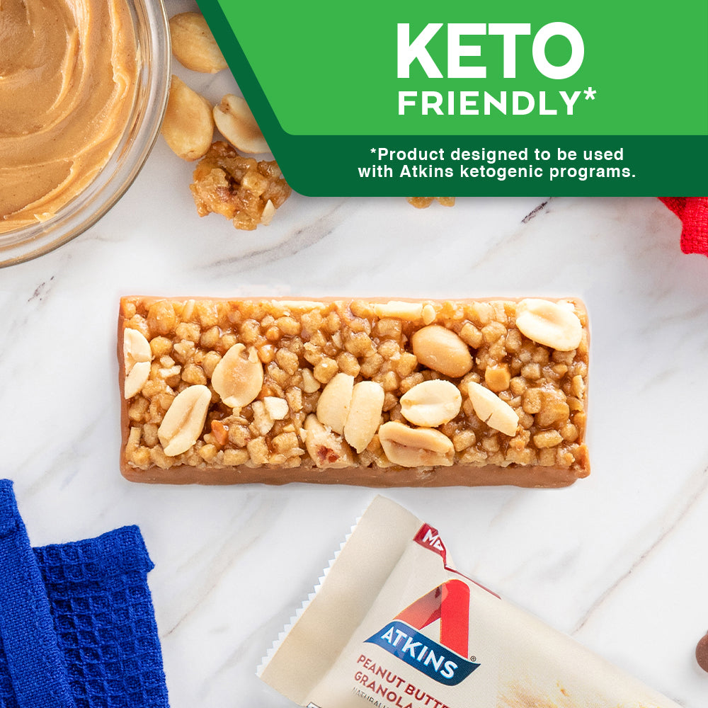 Peanut Butter Granola Bar with peanut butter and blue cloth on marble table; Keto The Atkins Way* *Product designed to be used with Atkins ketogenic programs.