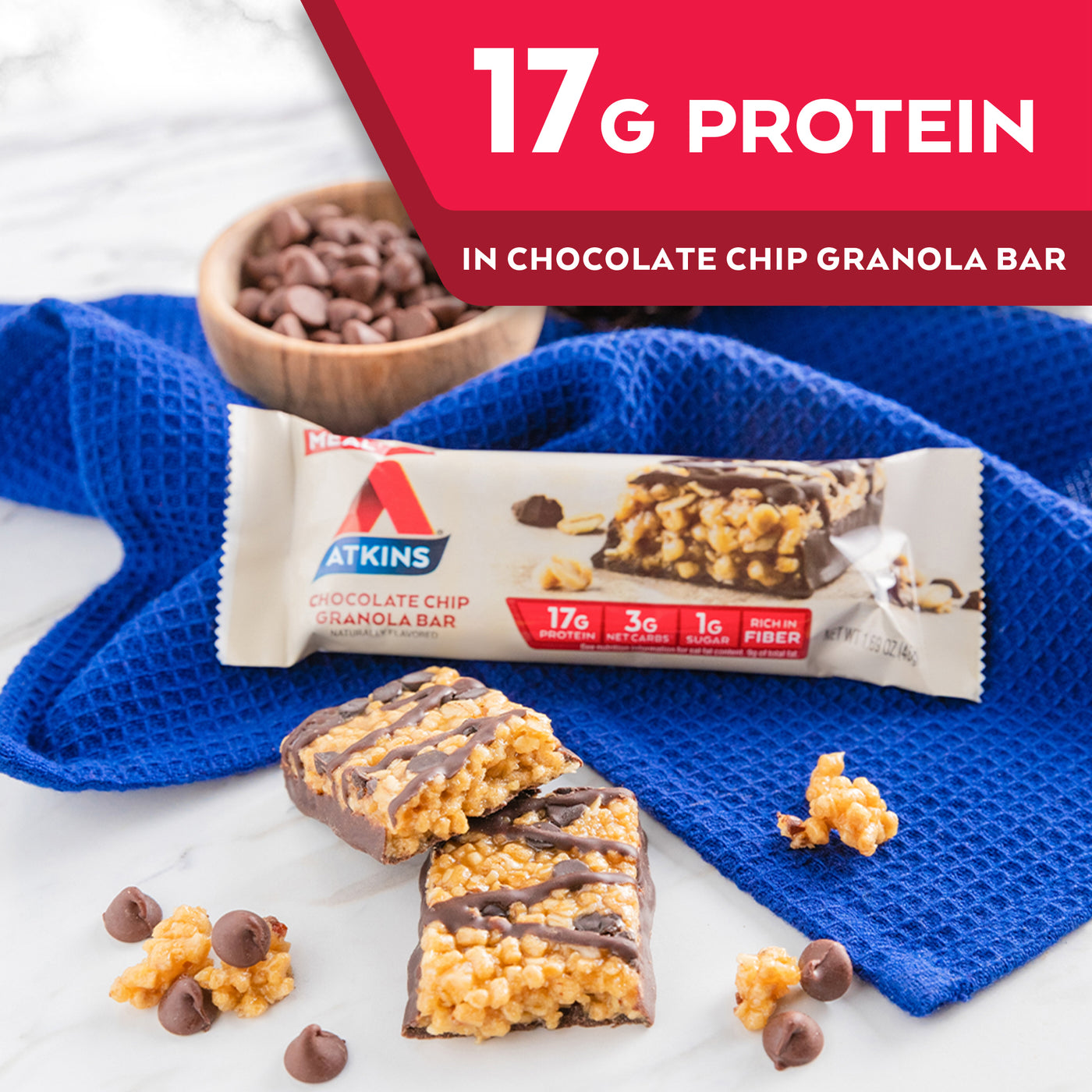 Chocolate Chip Granola Bar with chocolate chips and blue cloth on marble table; 17G Protein Chocolate Chip Granola Bar 